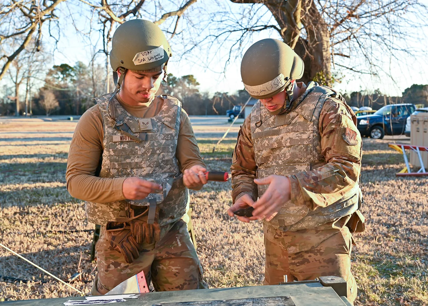 A technician's gauges connected to an AC system